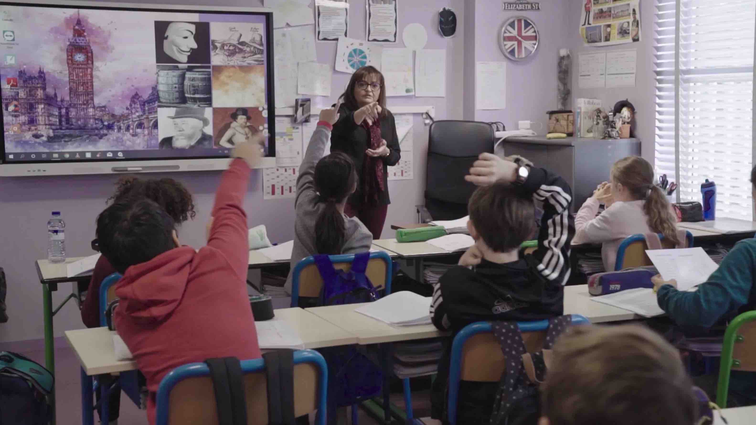 Teacher using SMART board for classroom lesson